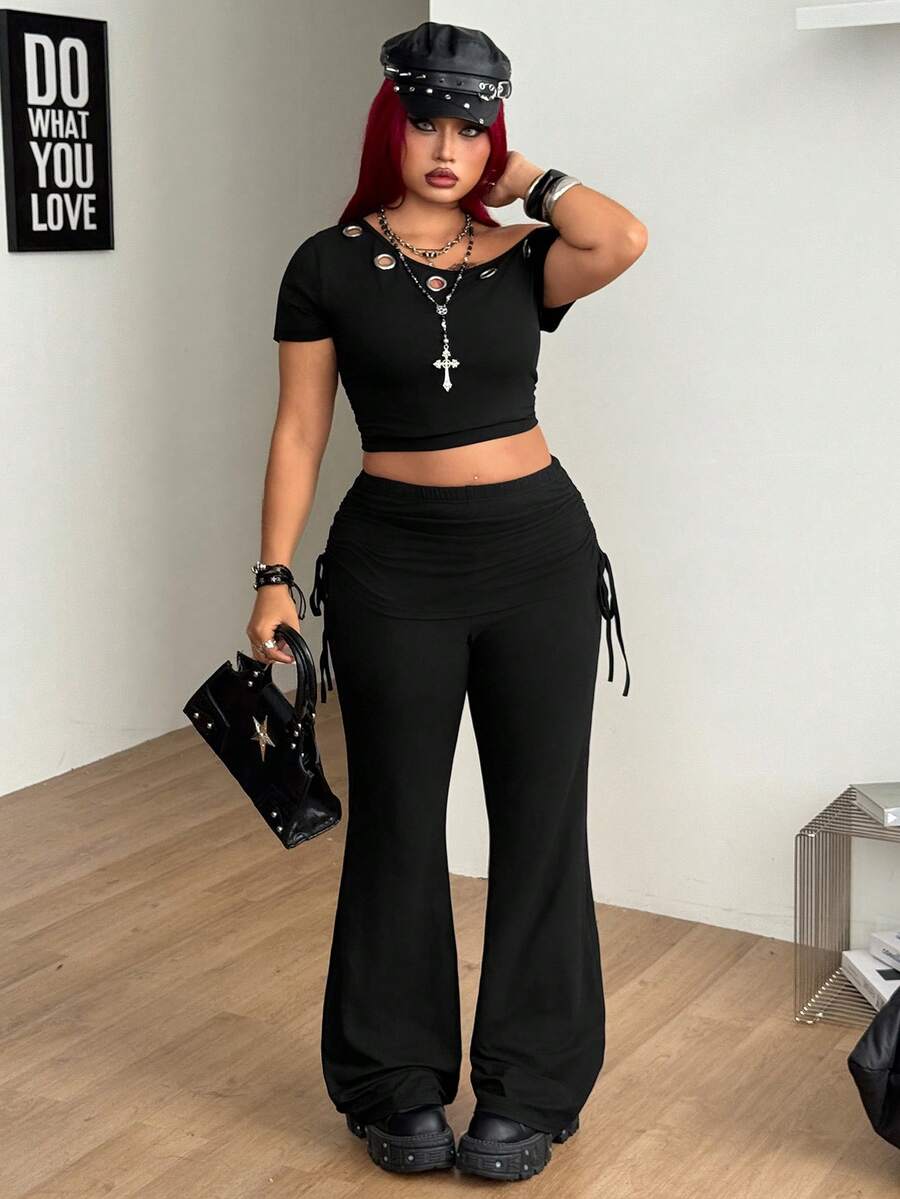 Women's striped flare leg pants featuring a mid-rise waist, slim fit thigh, and ruched side drawstring detail in stretch knit fabric.