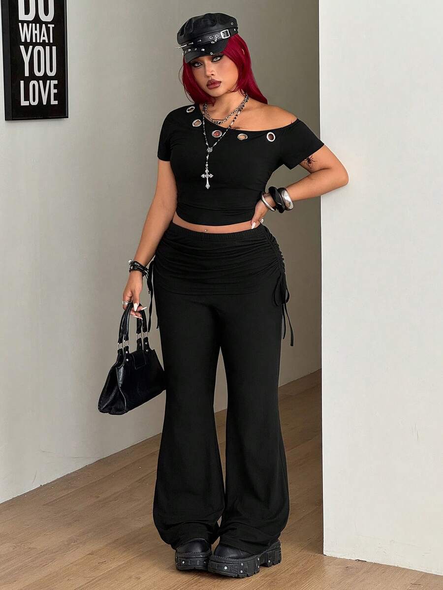 Women's striped flare leg pants featuring a mid-rise waist, slim fit thigh, and ruched side drawstring detail in stretch knit fabric.