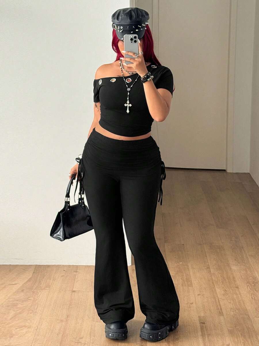 Women's striped flare leg pants featuring a mid-rise waist, slim fit thigh, and ruched side drawstring detail in stretch knit fabric.