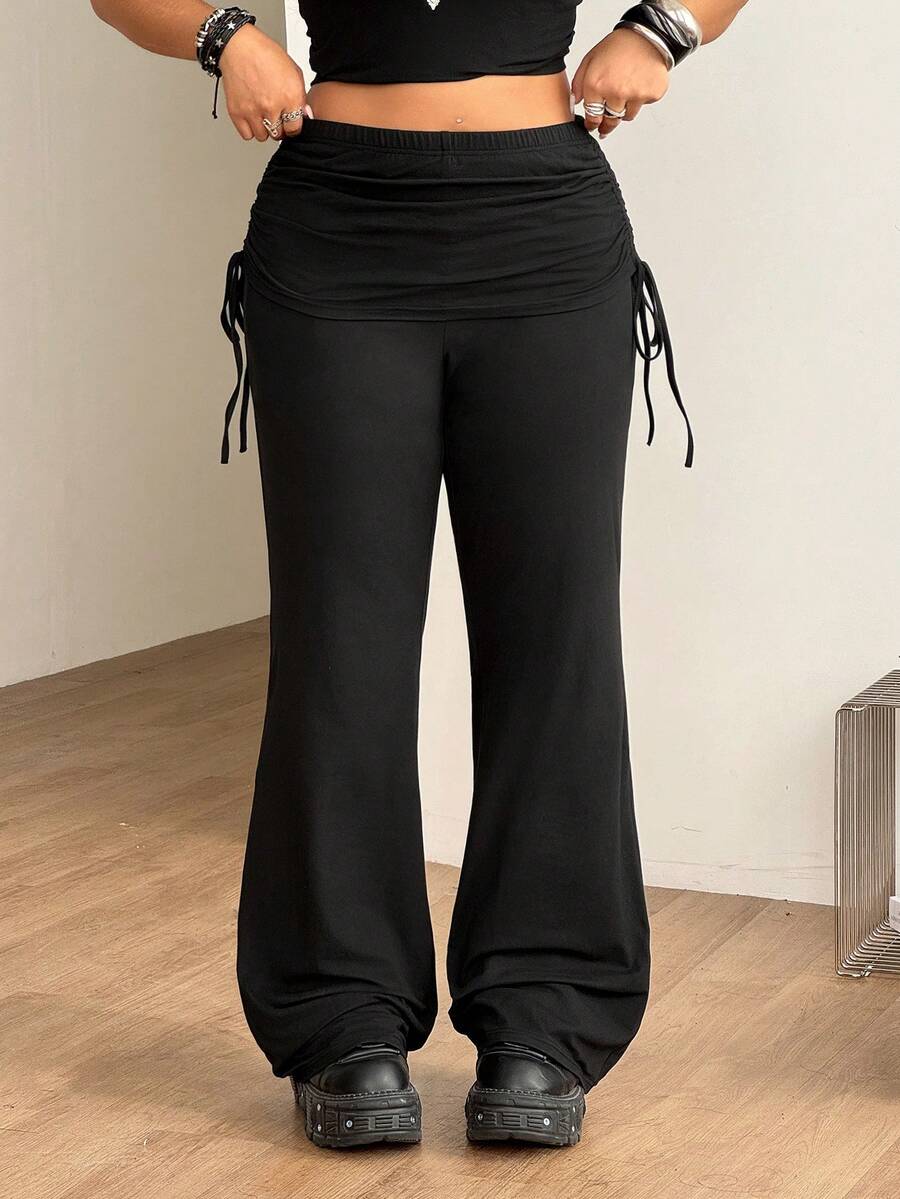 Women's striped flare leg pants featuring a mid-rise waist, slim fit thigh, and ruched side drawstring detail in stretch knit fabric.