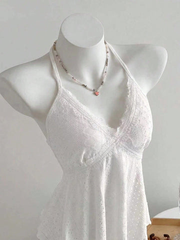 Women's halter crop camisole with textured detail, slim fit, and flared hem for beach vacation and spring or summer wear