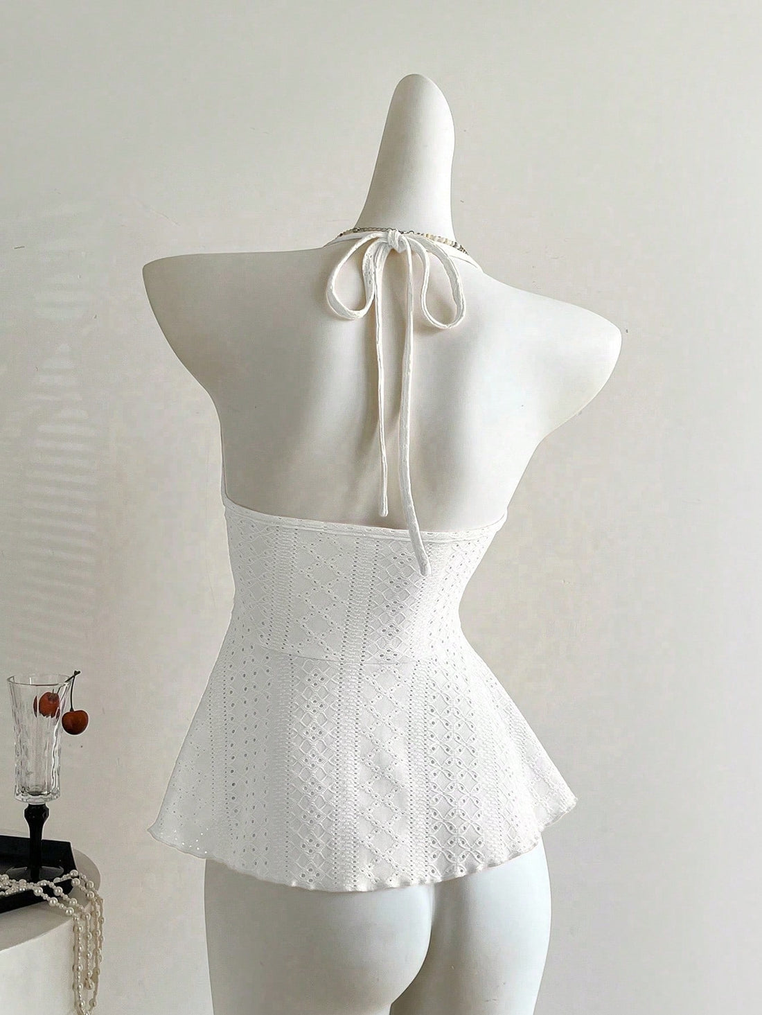 Women's halter crop camisole with textured detail, slim fit, and flared hem for beach vacation and spring or summer wear