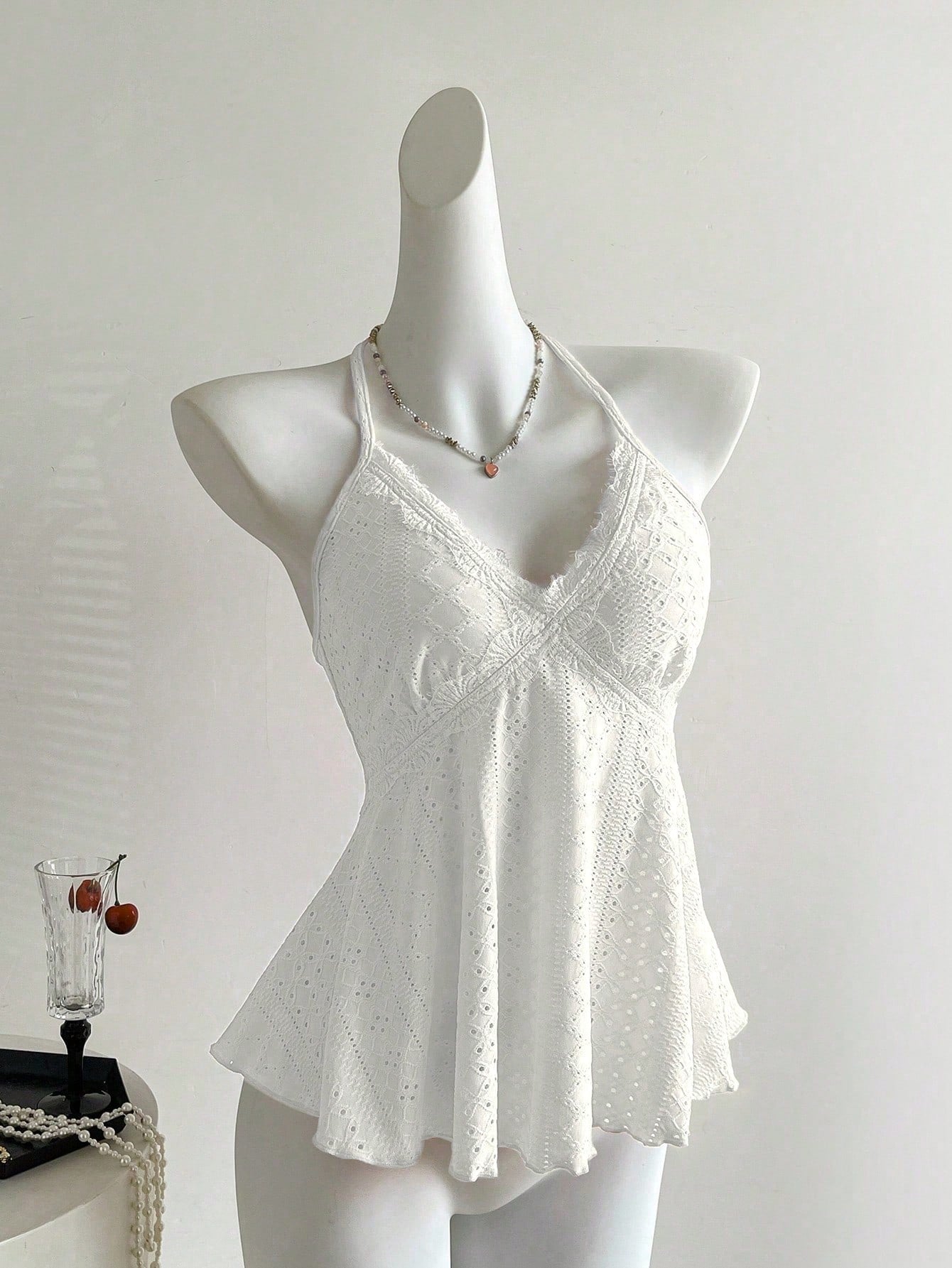 Women's halter crop camisole with textured detail, slim fit, and flared hem for beach vacation and spring or summer wear