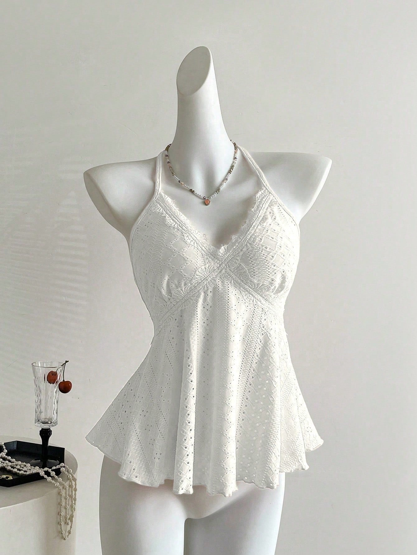 Women's halter crop camisole with textured detail, slim fit, and flared hem for beach vacation and spring or summer wear
