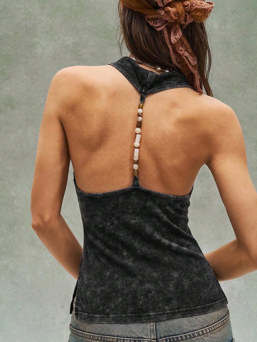 Women's casual solid color knit tank top with a backless halter neck design.
