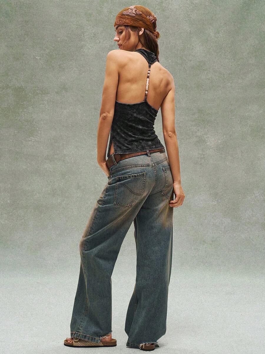Women's casual solid color knit tank top with a backless halter neck design.