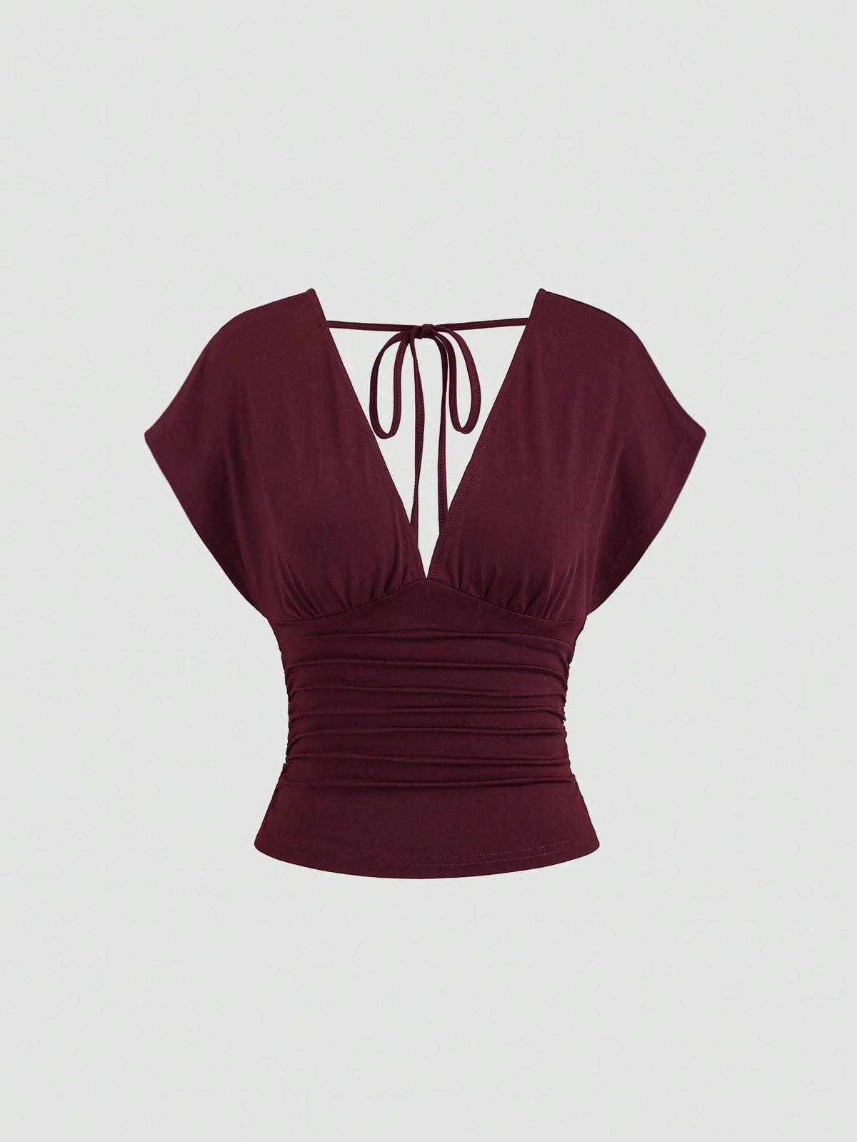 Women's black knitted t-shirt featuring a reversible deep v-neckline, batwing cap sleeves, ruched detailing, and a slim fit waist.