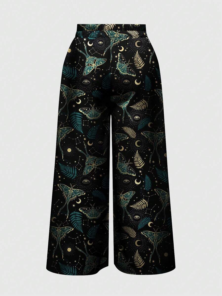 Women's plus size black gothic wide leg pants with split thigh detail and celestial moth, sun, and star pattern.