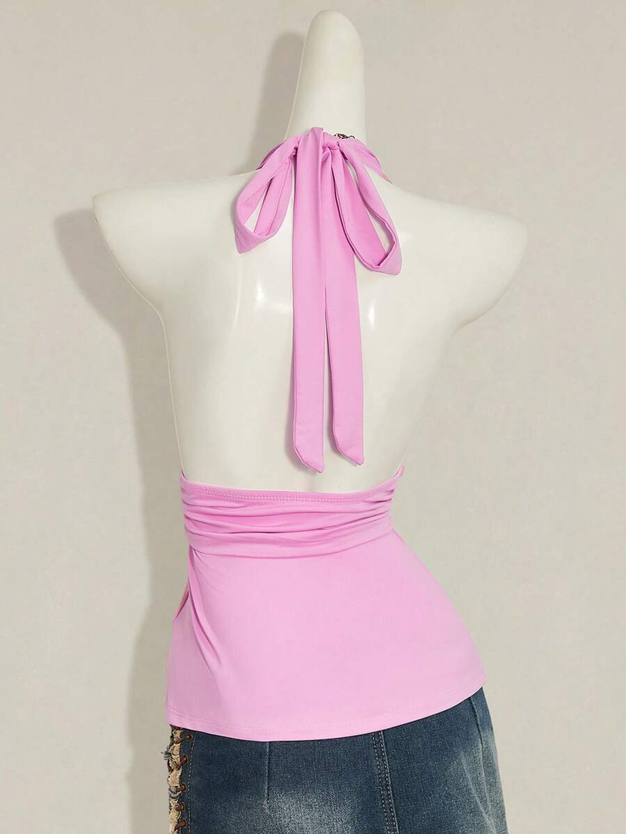 Women's backless halter babydoll tank top featuring a square neckline, slim fit silhouette, and a flared ruffle hem.