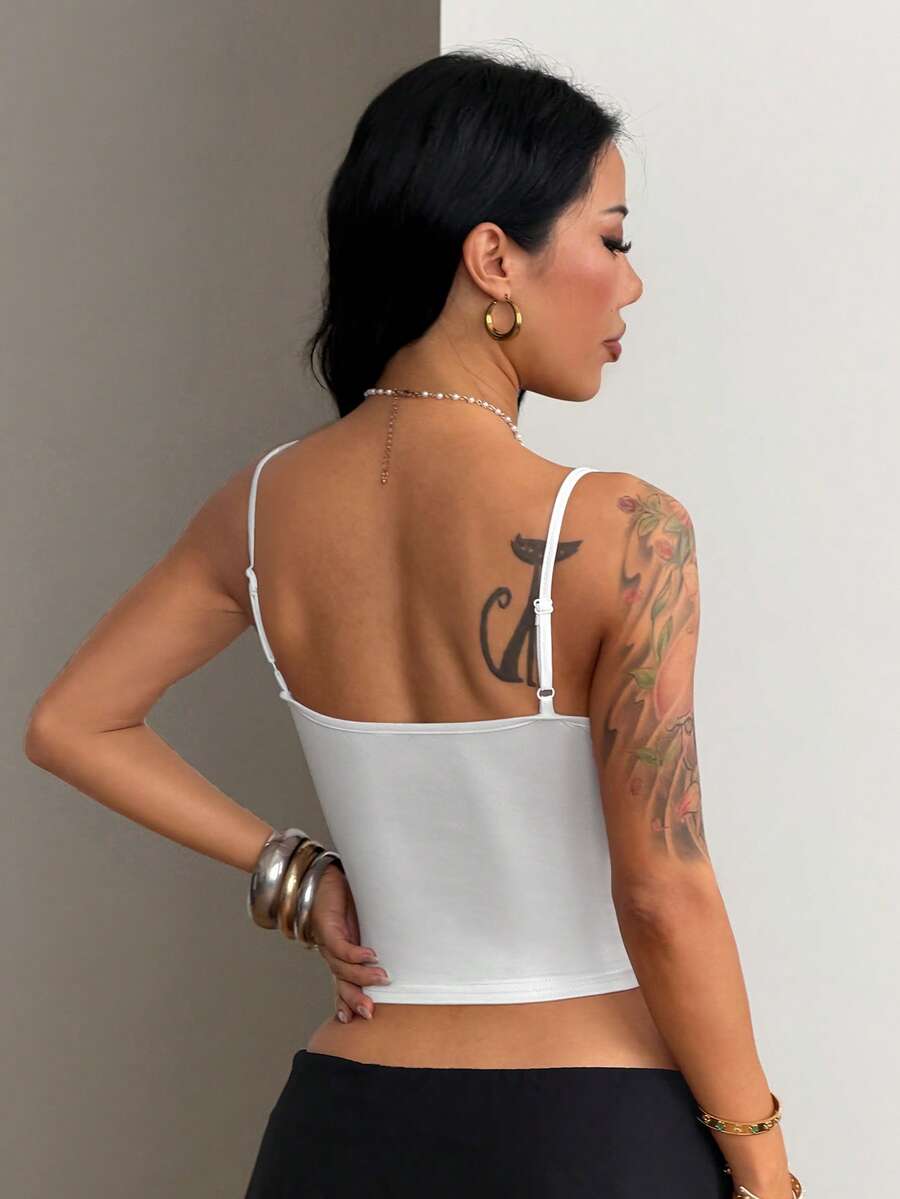 Women's graphic crop cami top with spaghetti straps and rhinestone detailing in soft knitted fabric