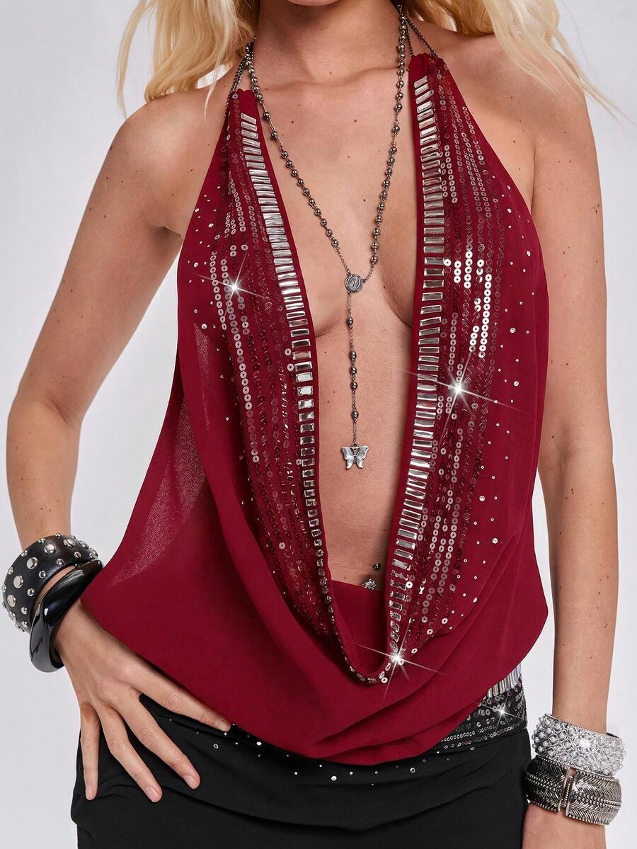 Women's draped neck backless halter crop tank top with studded details, letter pattern, semi-sheer chiffon fabric, and slim fit party style