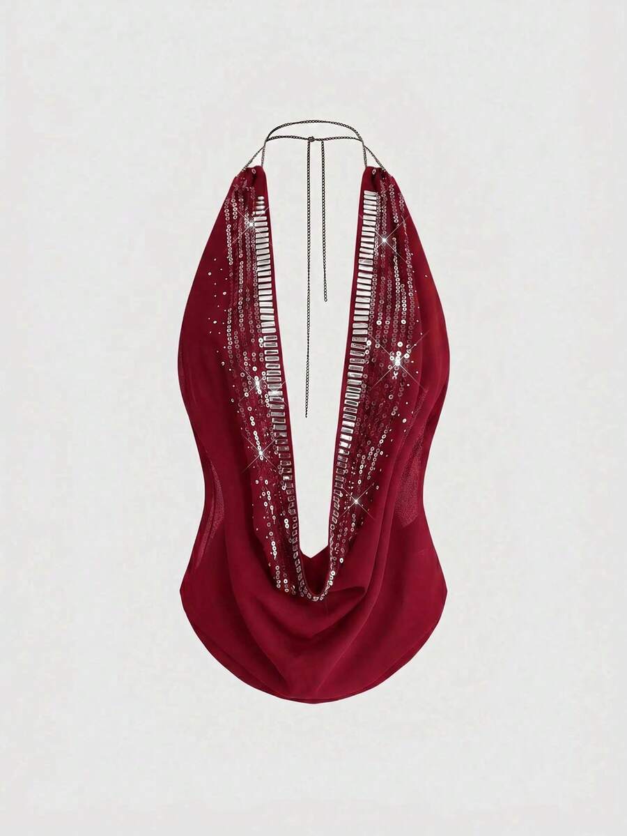 Women's draped neck backless halter crop tank top with studded details, letter pattern, semi-sheer chiffon fabric, and slim fit party style