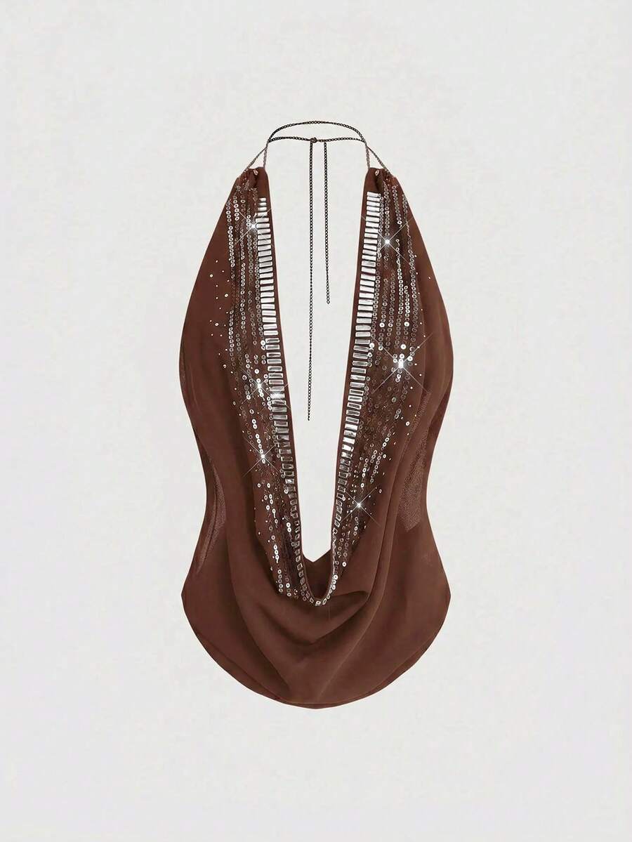 Women's draped neck backless halter crop tank top with studded details, letter pattern, semi-sheer chiffon fabric, and slim fit party style
