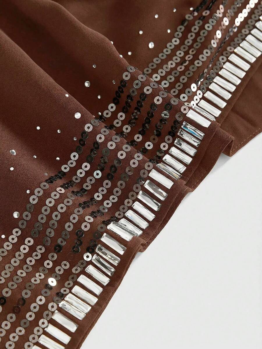 Women's draped neck backless halter crop tank top with studded details, letter pattern, semi-sheer chiffon fabric, and slim fit party style