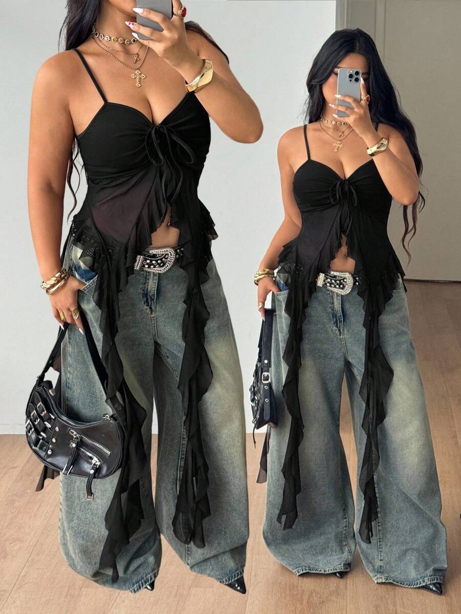 Women's plus size black mesh tank top featuring spaghetti straps, a backless knot detail, and an asymmetrical ruffled hem.