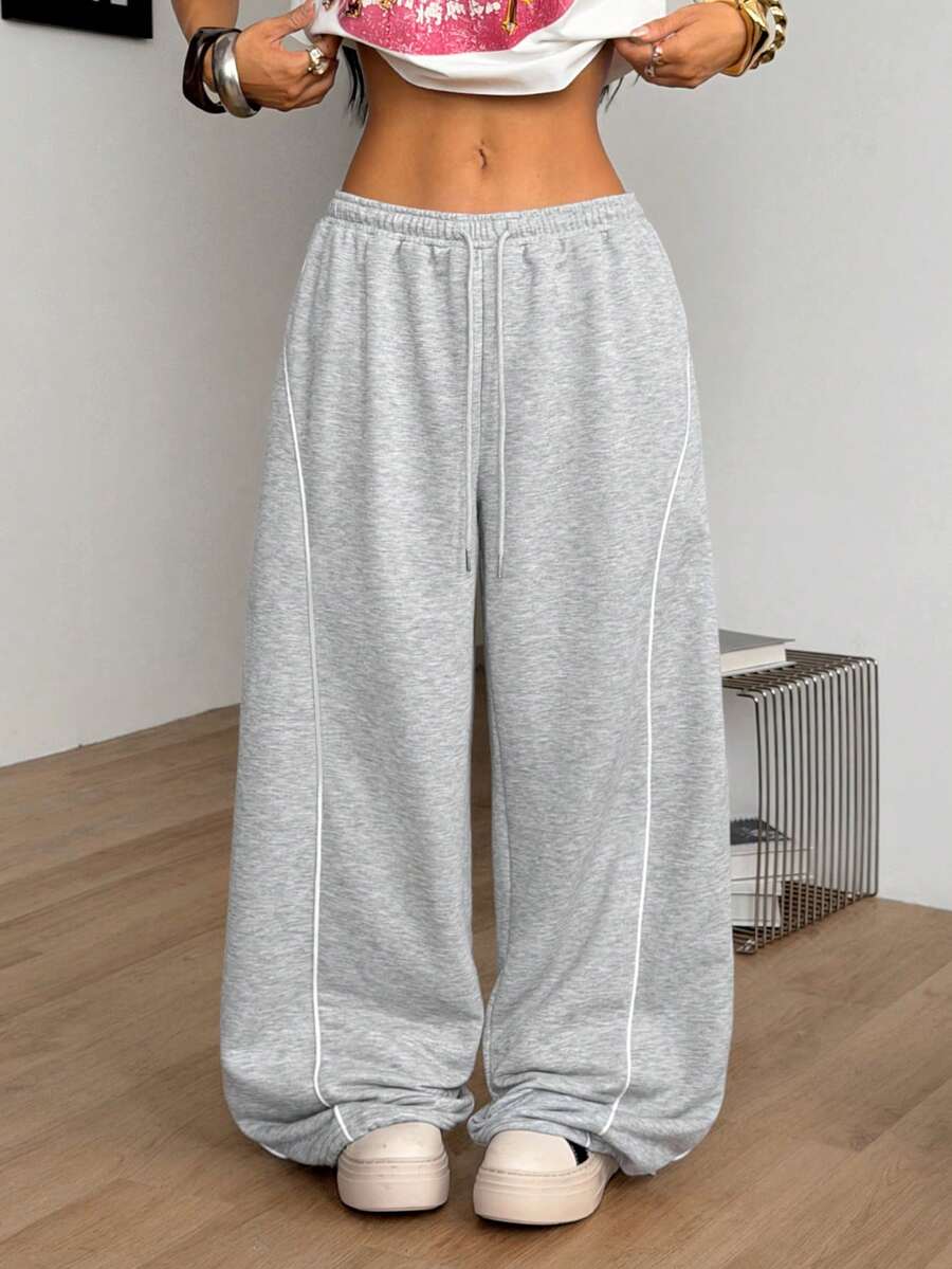 Women's wide leg trousers with a tree branch graphic pattern, loose fit, and mid-rise waist in woven fabric.