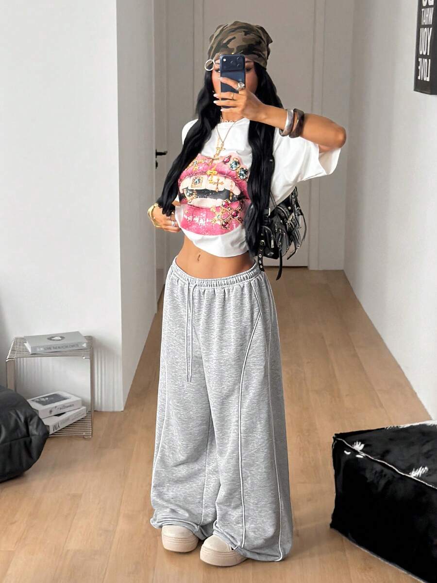 Women's wide leg trousers with a tree branch graphic pattern, loose fit, and mid-rise waist in woven fabric.