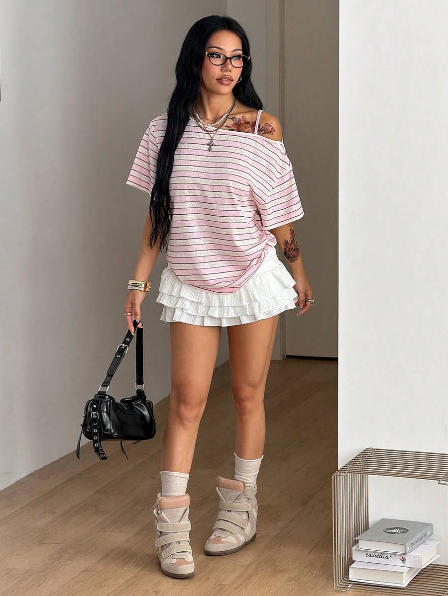Women's casual loose fit cold shoulder cotton t-shirt with asymmetrical cutout neckline and short sleeves.
