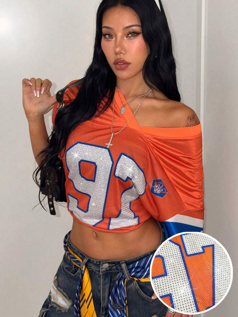 Women's oversized mesh jersey t-shirt with sporty number print, short drop-shoulder sleeves, and V-neckline.