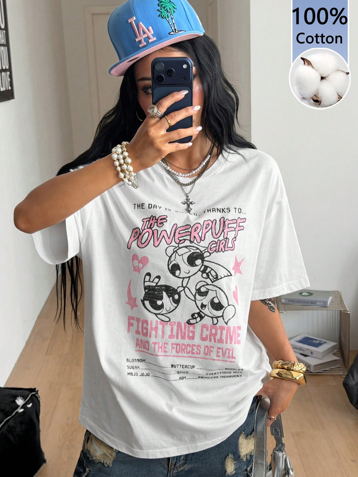 Women's oversized graphic crew neck t-shirt made of 100% white cotton knitted fabric with drop shoulder half sleeves.