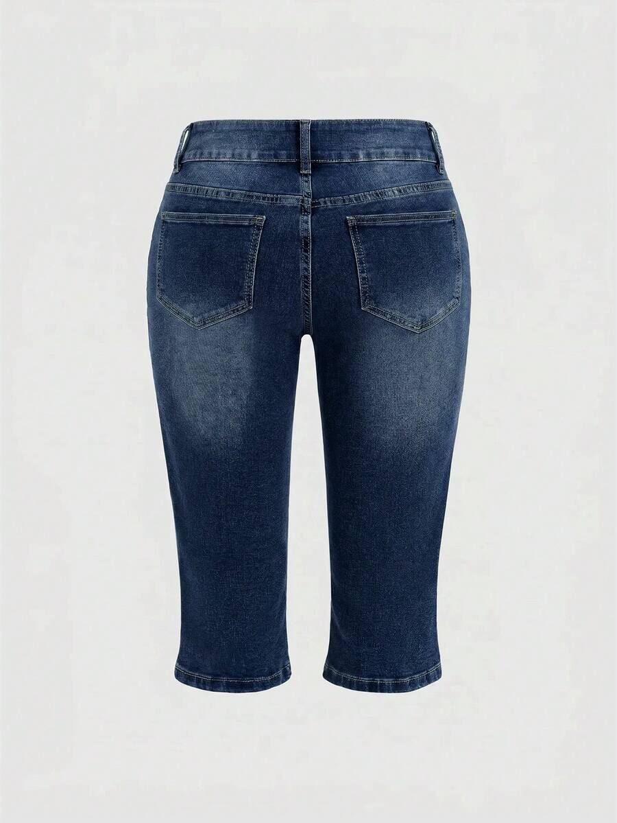 Women's ultra low-rise skinny denim shorts featuring sparkling gold rhinestone embellishments with front pockets and zipper fly.