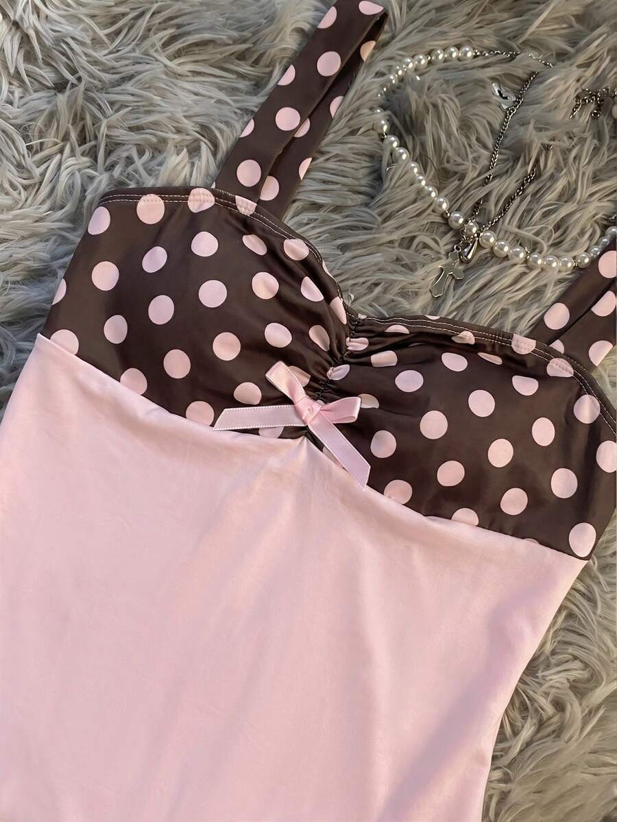Multicolor Y2K slim fit crop top with wide straps, polka dot print, ruched shirred design, bow accents, and a flared ruffle hem.