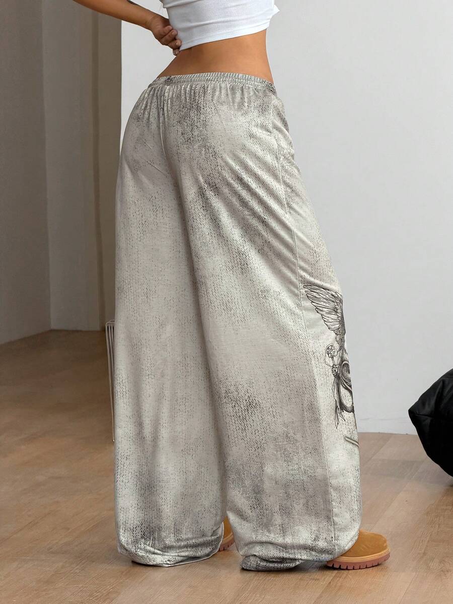 Women's loose fit wide leg graphic sweatpants in light grey with an elastic drawstring waistband