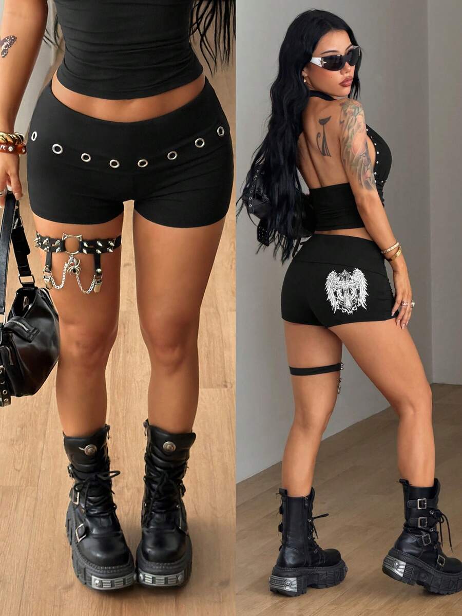 Women's black ultra low rise mini shorts with grommet eyelet and rib-knit details, zipper fly closure, skinny straight-leg fit, and plain knitted fabric.