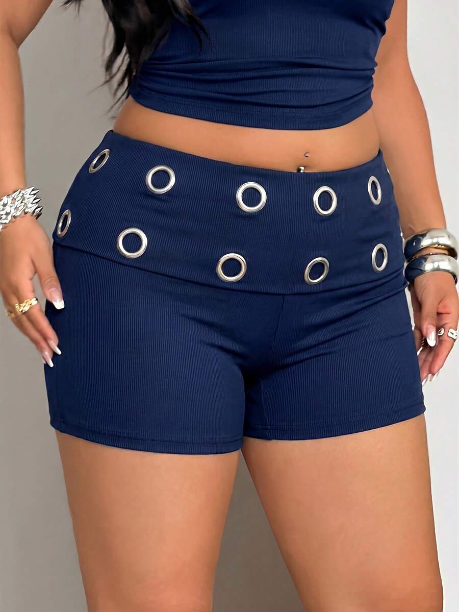 Women's black studded mini shorts crafted from stretch knitted fabric featuring an elastic waistband and skinny fit.