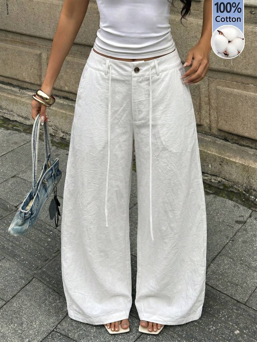 Women's casual straight leg striped woven pants featuring a low waist and zipper fly closure.