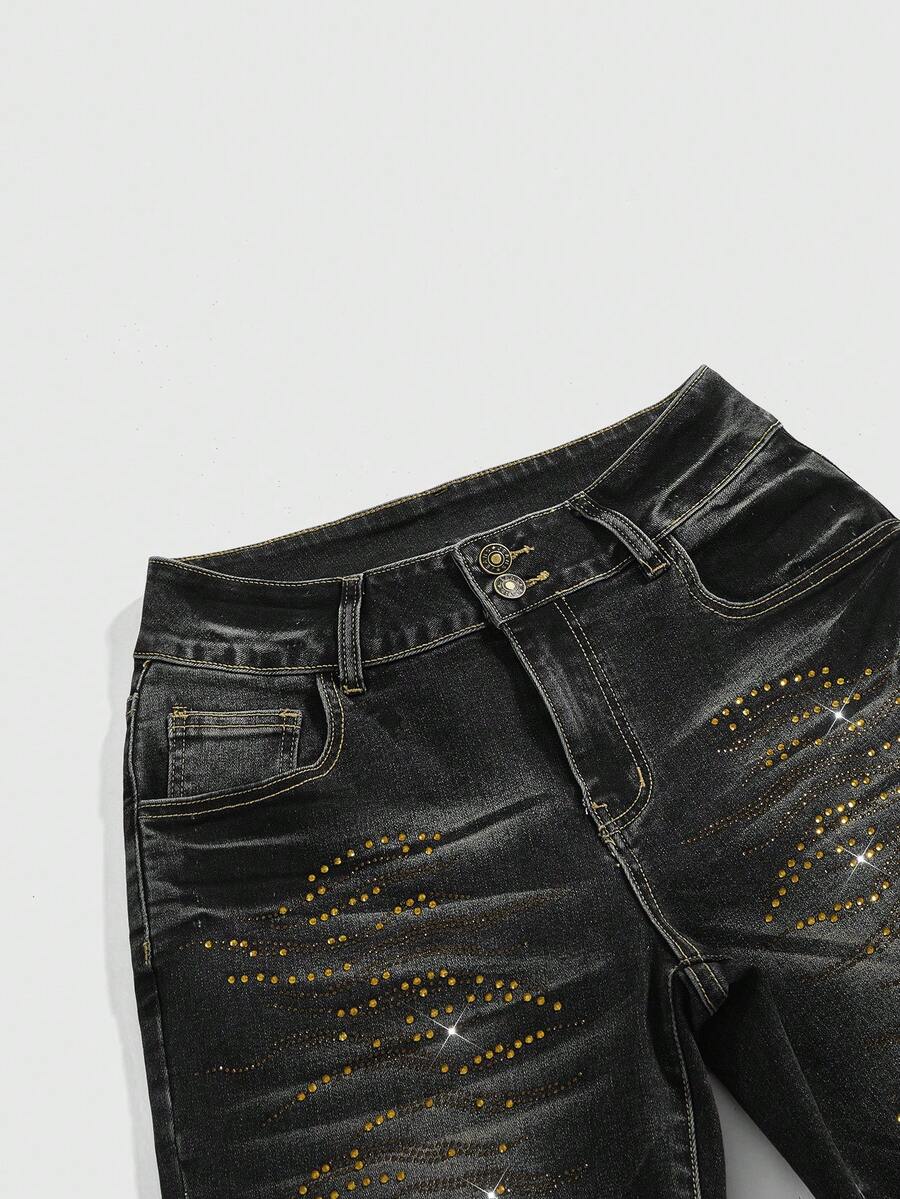 Women's ultra low-rise skinny denim shorts featuring sparkling gold rhinestone embellishments with front pockets and zipper fly.