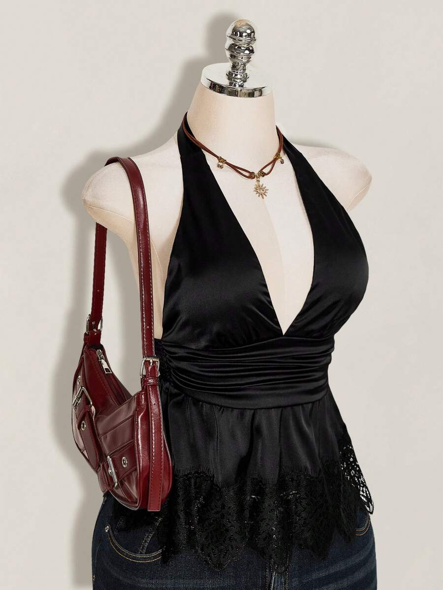 White women's deep V-neck halter tank top with ruched waist, backless design, rib-knit texture, and ruffle hem