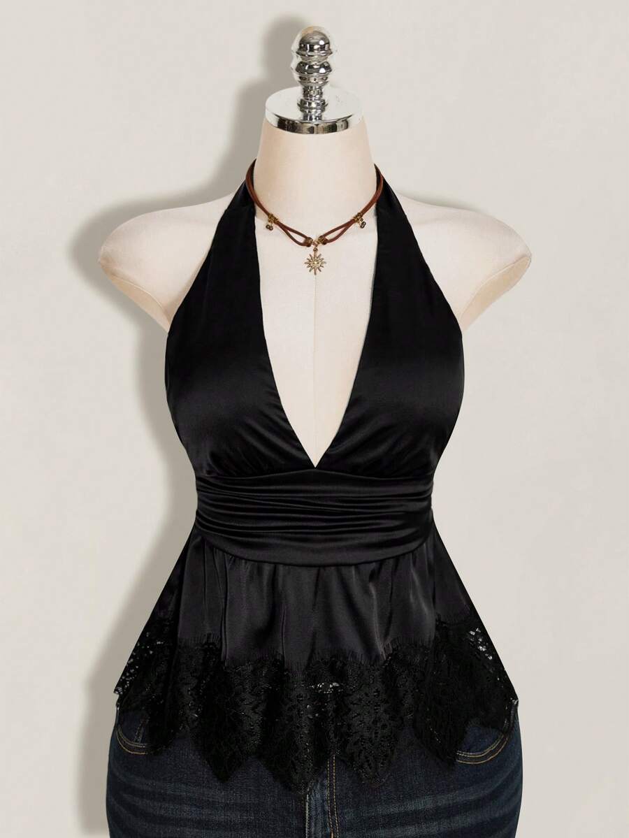 White women's deep V-neck halter tank top with ruched waist, backless design, rib-knit texture, and ruffle hem