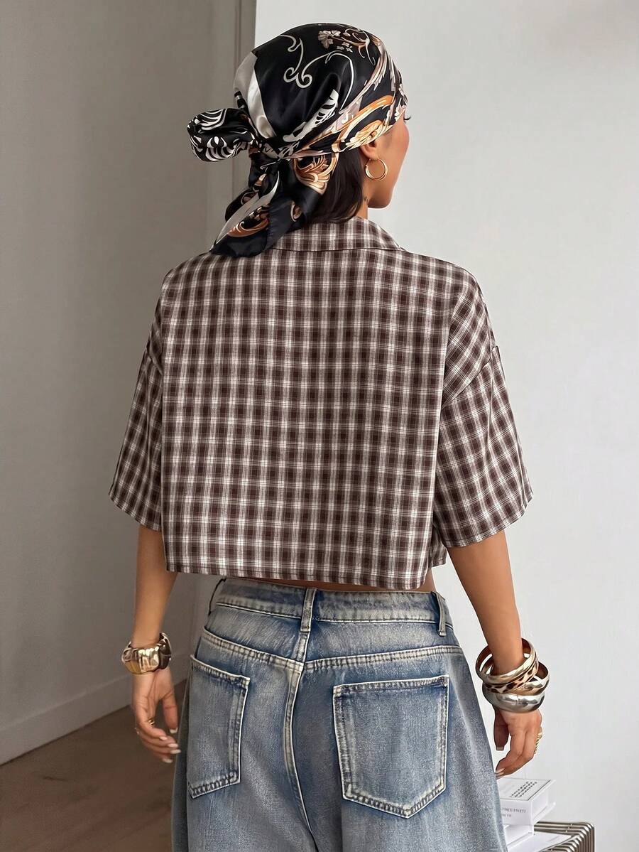 Women's plaid crop shirt with button front, chest pocket, short sleeves, and loose casual fit.
