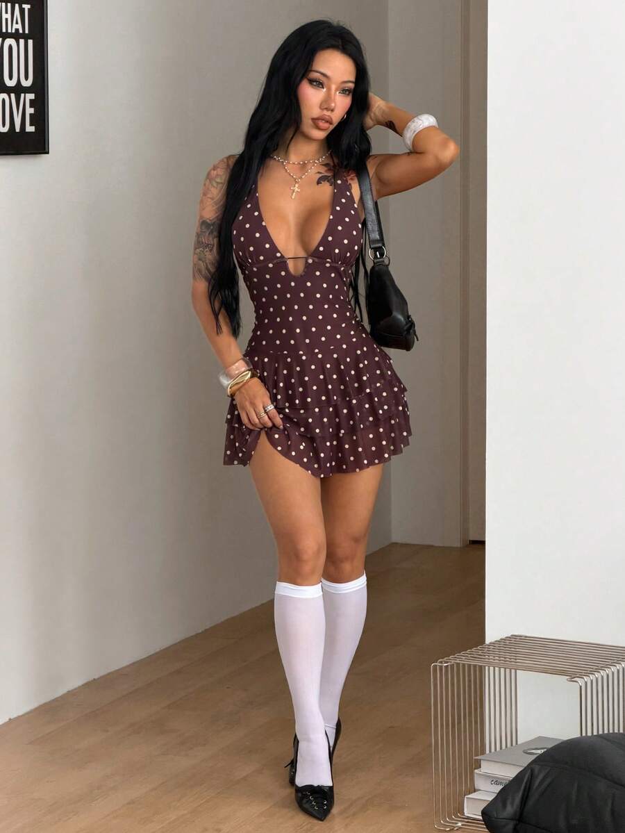 Front view of a women's lace halter mini dress featuring a slim-fit bodice, flared hem, and sleeveless design.