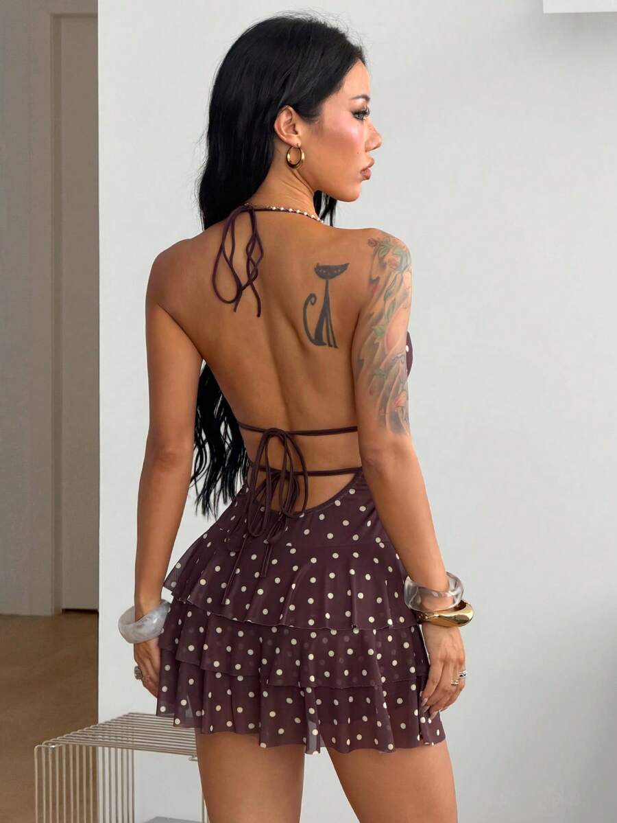 Front view of a women's lace halter mini dress featuring a slim-fit bodice, flared hem, and sleeveless design.