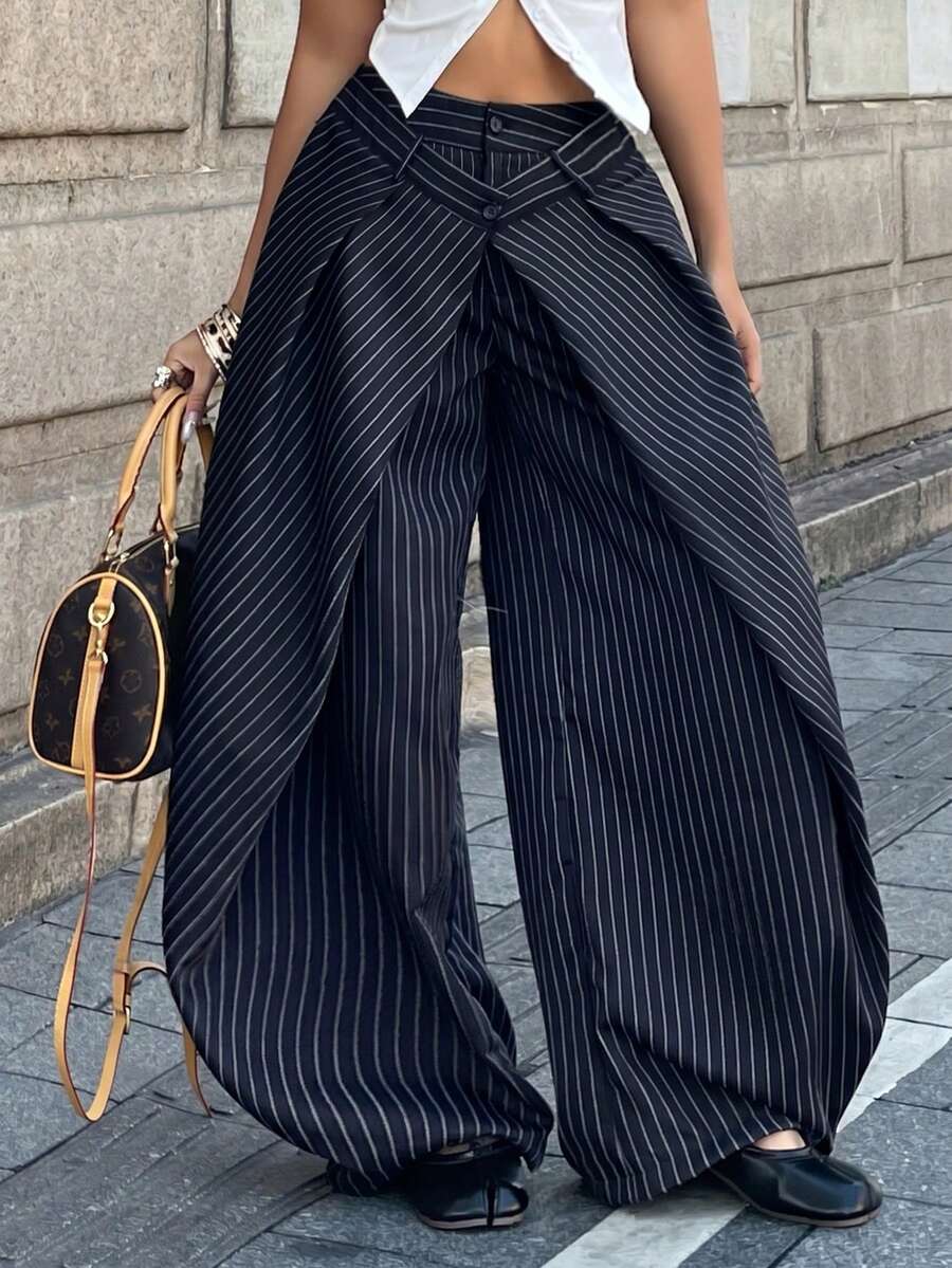 Women's loose fit pleated wide leg pants in royal blue pinstripe woven fabric with zipper fly closure.