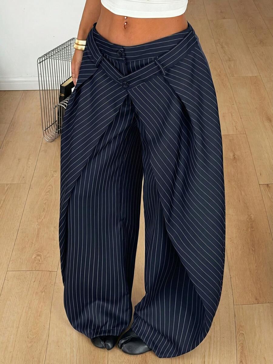 Women's loose fit pleated wide leg pants in royal blue pinstripe woven fabric with zipper fly closure.