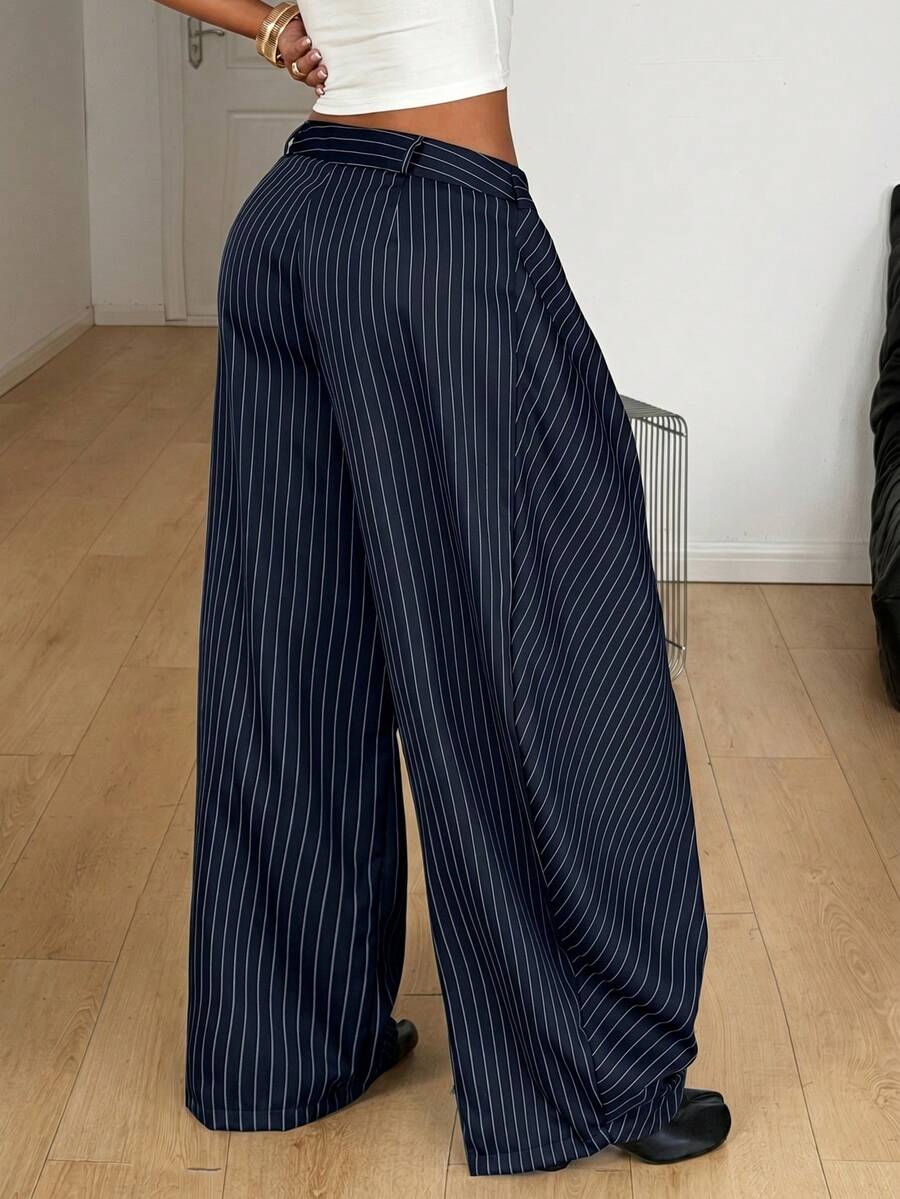 Women's loose fit pleated wide leg pants in royal blue pinstripe woven fabric with zipper fly closure.