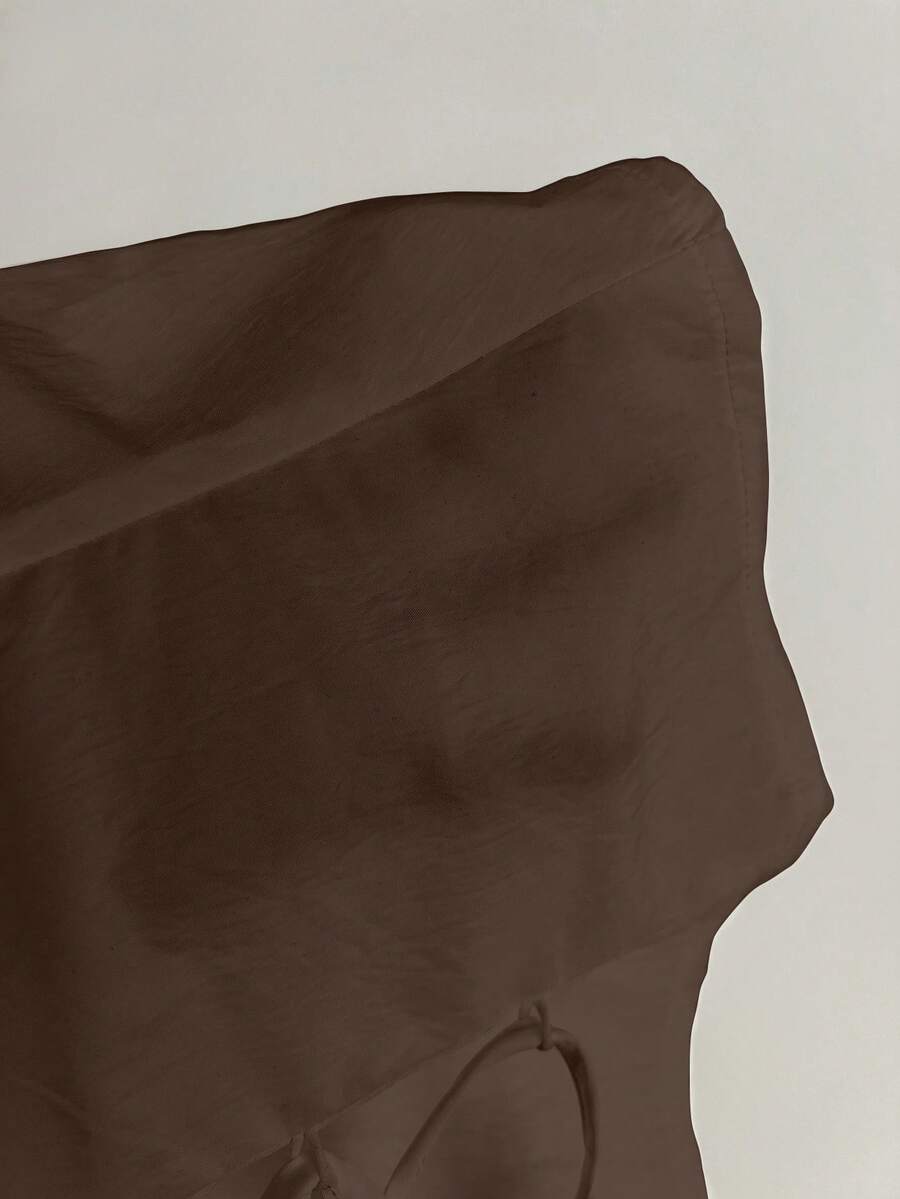 Women's black off-shoulder cap sleeve blouse with ruffled detailing and a tie-back design.