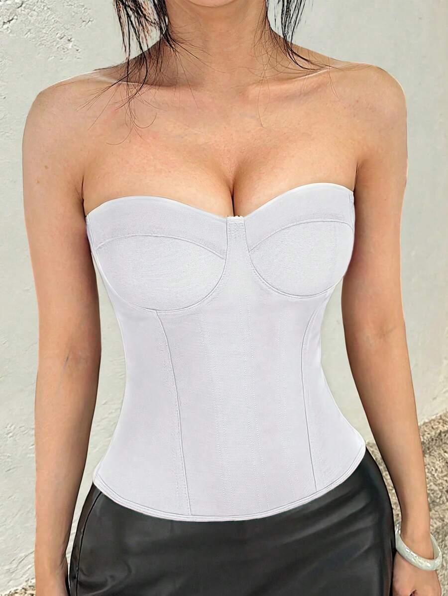 Solid color strapless corset tube top featuring a backless lace-up back design and cropped slim fit.