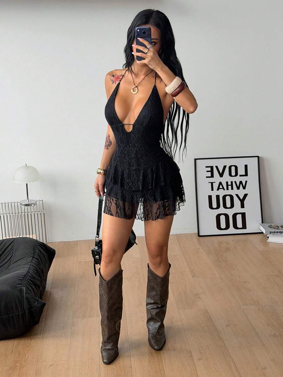 Front view of a women's lace halter mini dress featuring a slim-fit bodice, flared hem, and sleeveless design.