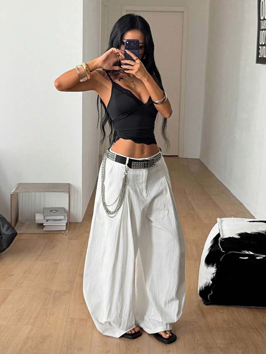 Casual black striped woven long pants for women featuring a low waist and loose fit design.
