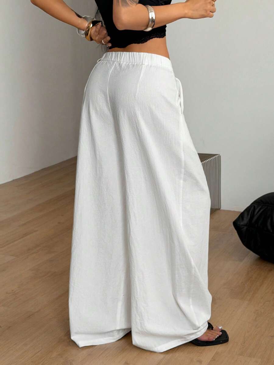 Casual black striped woven long pants for women featuring a low waist and loose fit design.