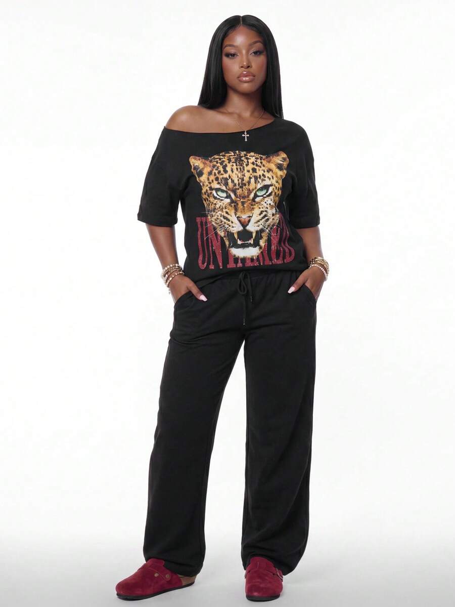 Women's two-piece lounge set featuring a loose drop shoulder asymmetrical neck short sleeve t-shirt and wide-leg knit pants with pockets.