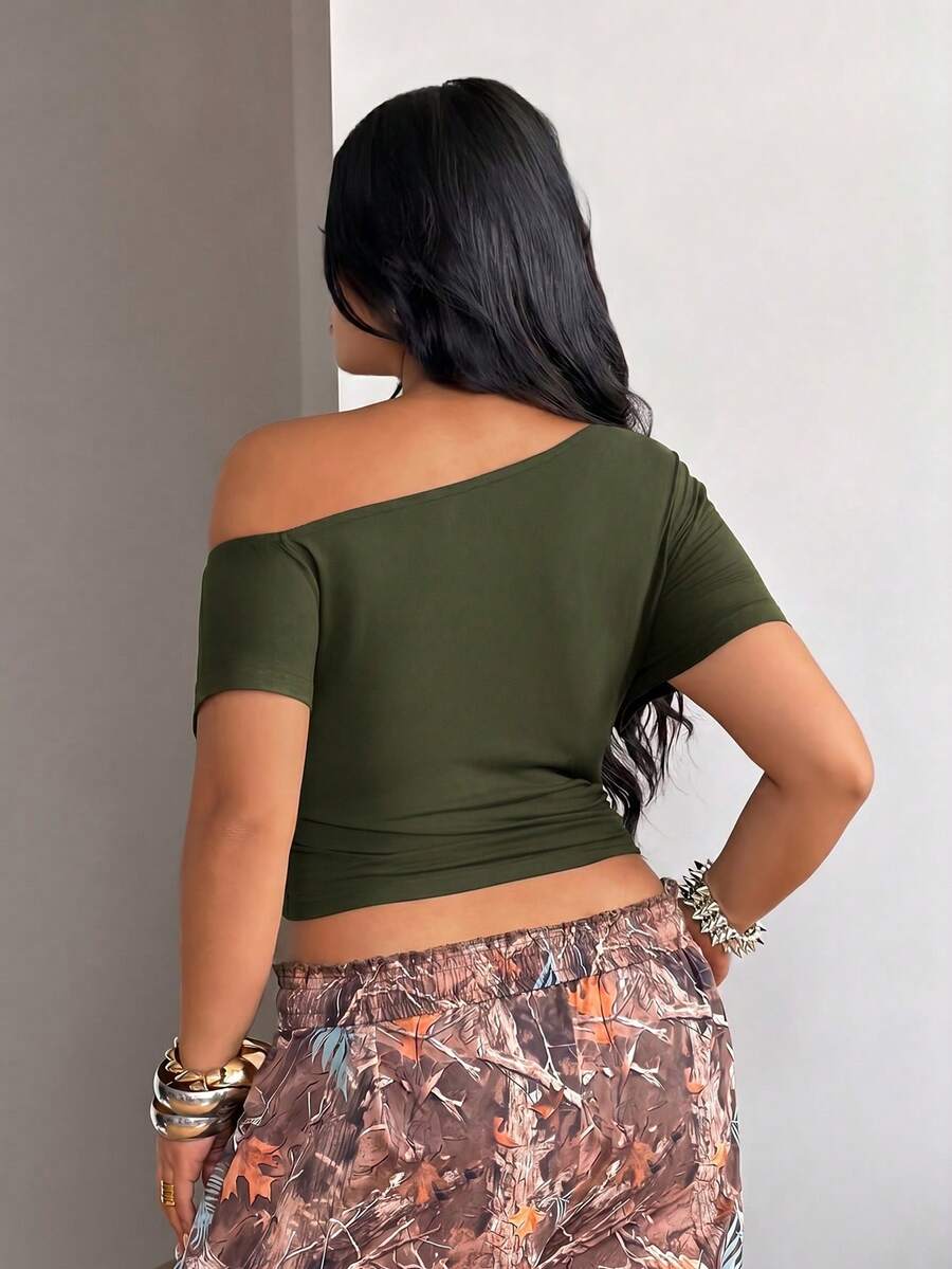 Army green women's one shoulder short sleeve crop t-shirt featuring asymmetrical grommet eyelet details.