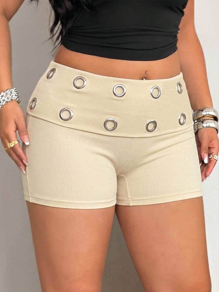 Women's black studded mini shorts crafted from stretch knitted fabric featuring an elastic waistband and skinny fit.