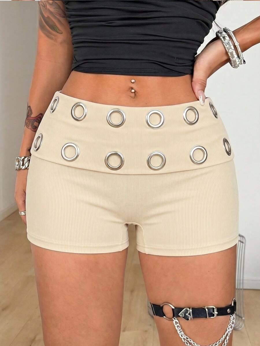 Women's black studded mini shorts crafted from stretch knitted fabric featuring an elastic waistband and skinny fit.