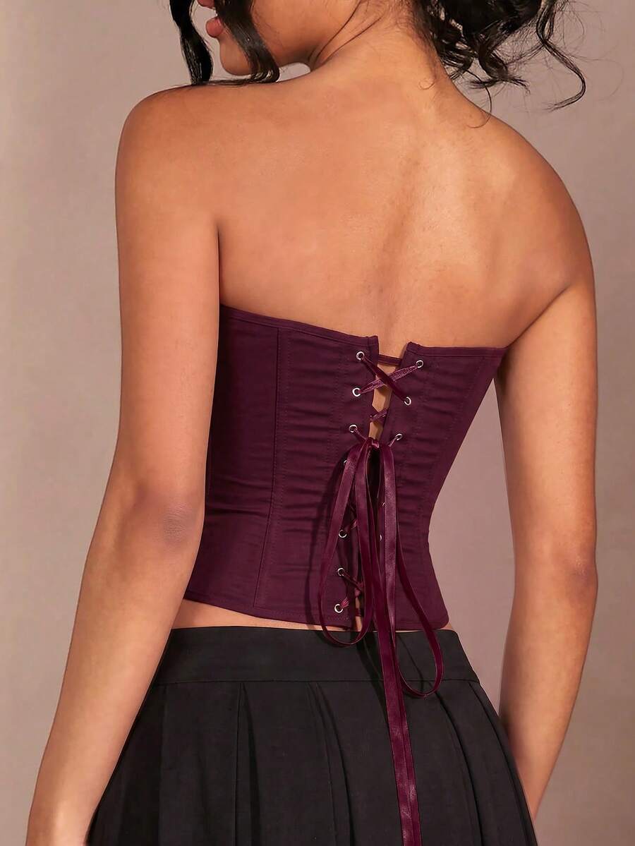 Solid color strapless corset tube top featuring a backless lace-up back design and cropped slim fit.