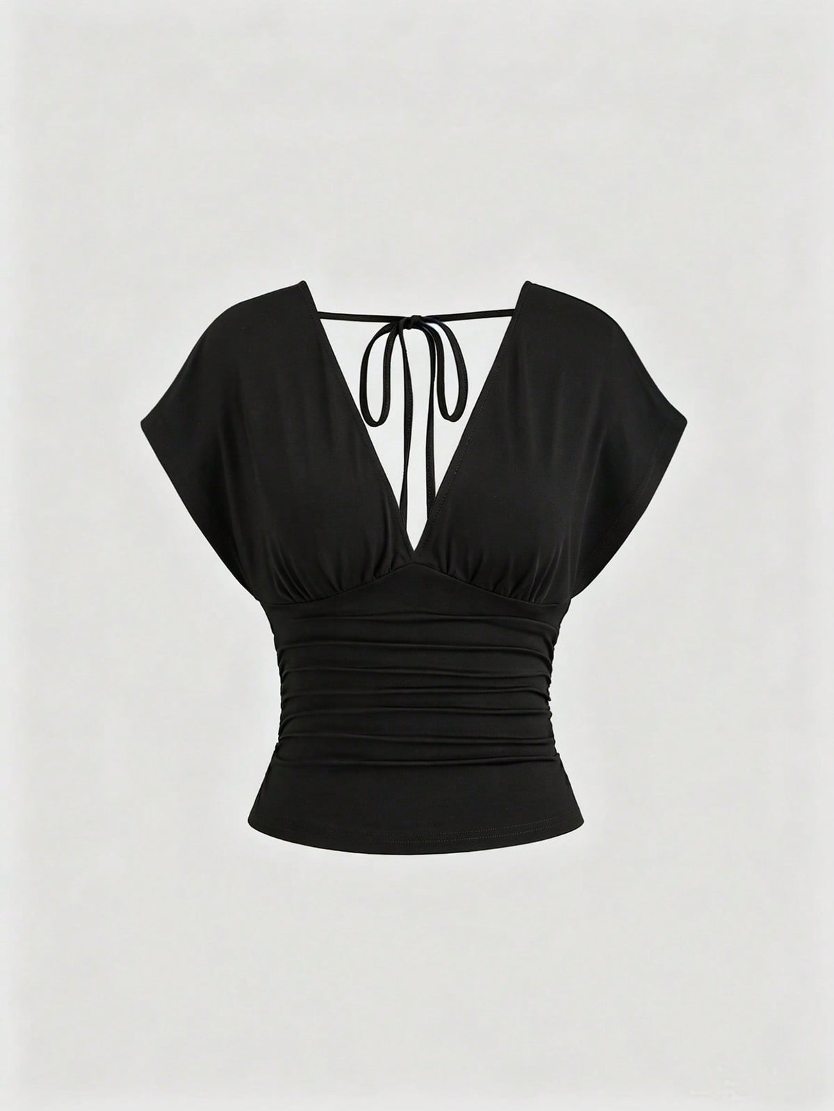 Women's black knitted t-shirt featuring a reversible deep v-neckline, batwing cap sleeves, ruched detailing, and a slim fit waist.